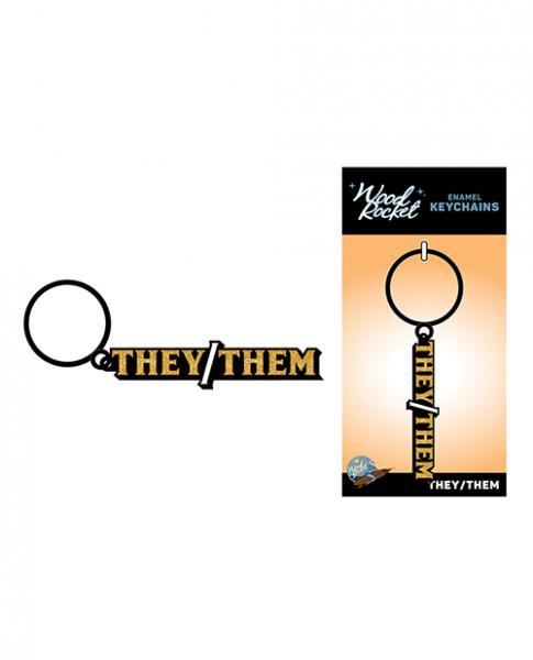 CNVELD-WR-KEY-034640b0e1e64b11 Wood Rocket They/them Keychain - Black/gold - Image 1